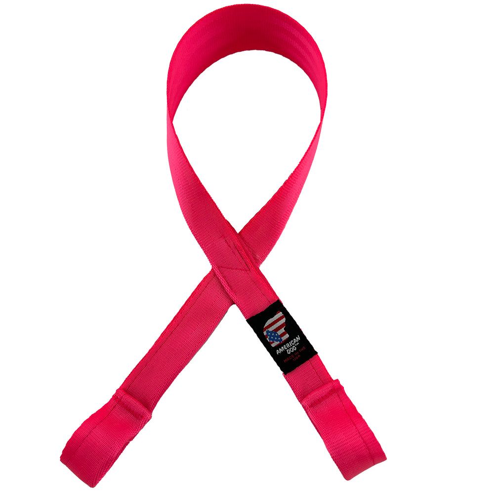 Awareness Seat Belt Tug, pink seat belt webbing crossed into an awareness ribbon, with a loop at each end