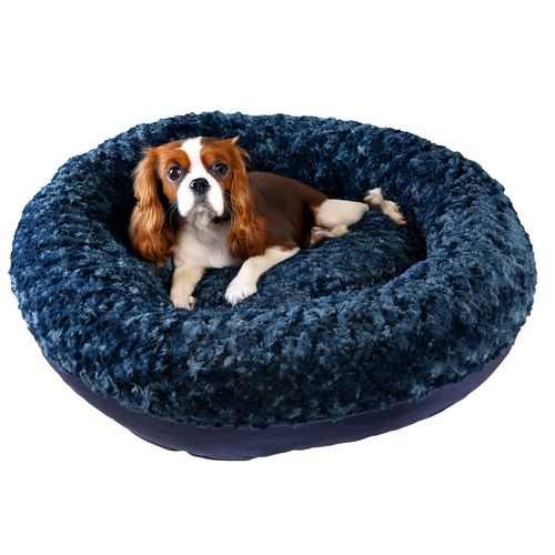Furvana™ Round Bolster Bed in Midnight, with a dog on it