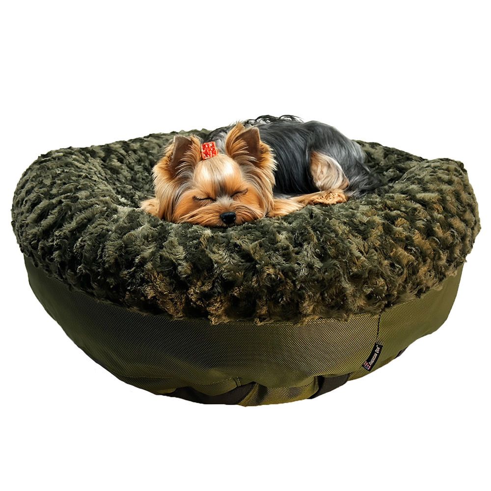 Furvana™ Round Bolster Bed in Olive, with a dog on it